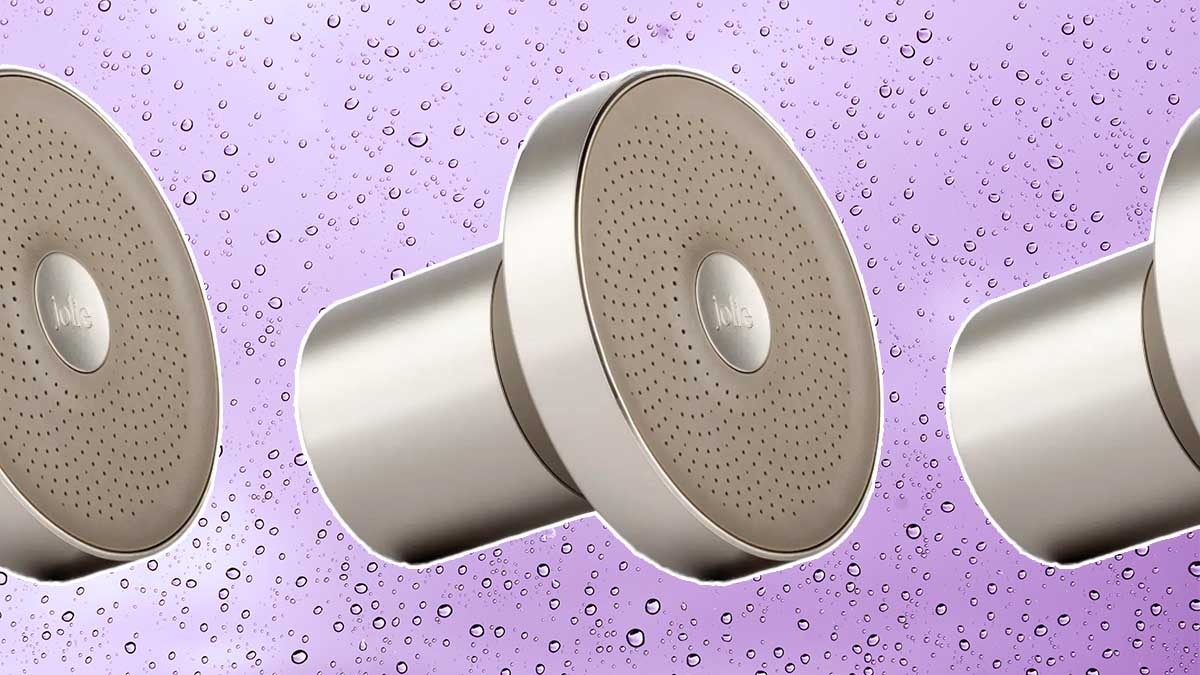 The Filtered Showerhead from Jolie, on a purple backgrund with water droplets