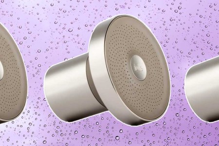 The Filtered Showerhead from Jolie, on a purple backgrund with water droplets