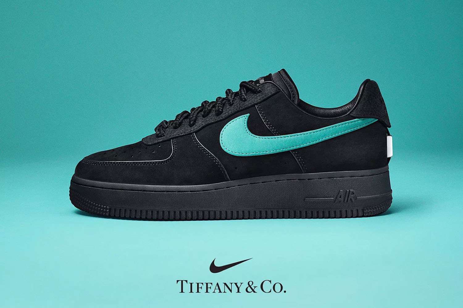 a pair of black Tiffany x Nike Air Force 1 on a light blue background