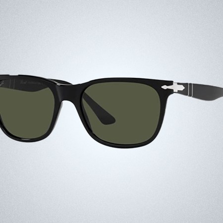 a pair of black Persol PO3291S sunglasses on a grey background
