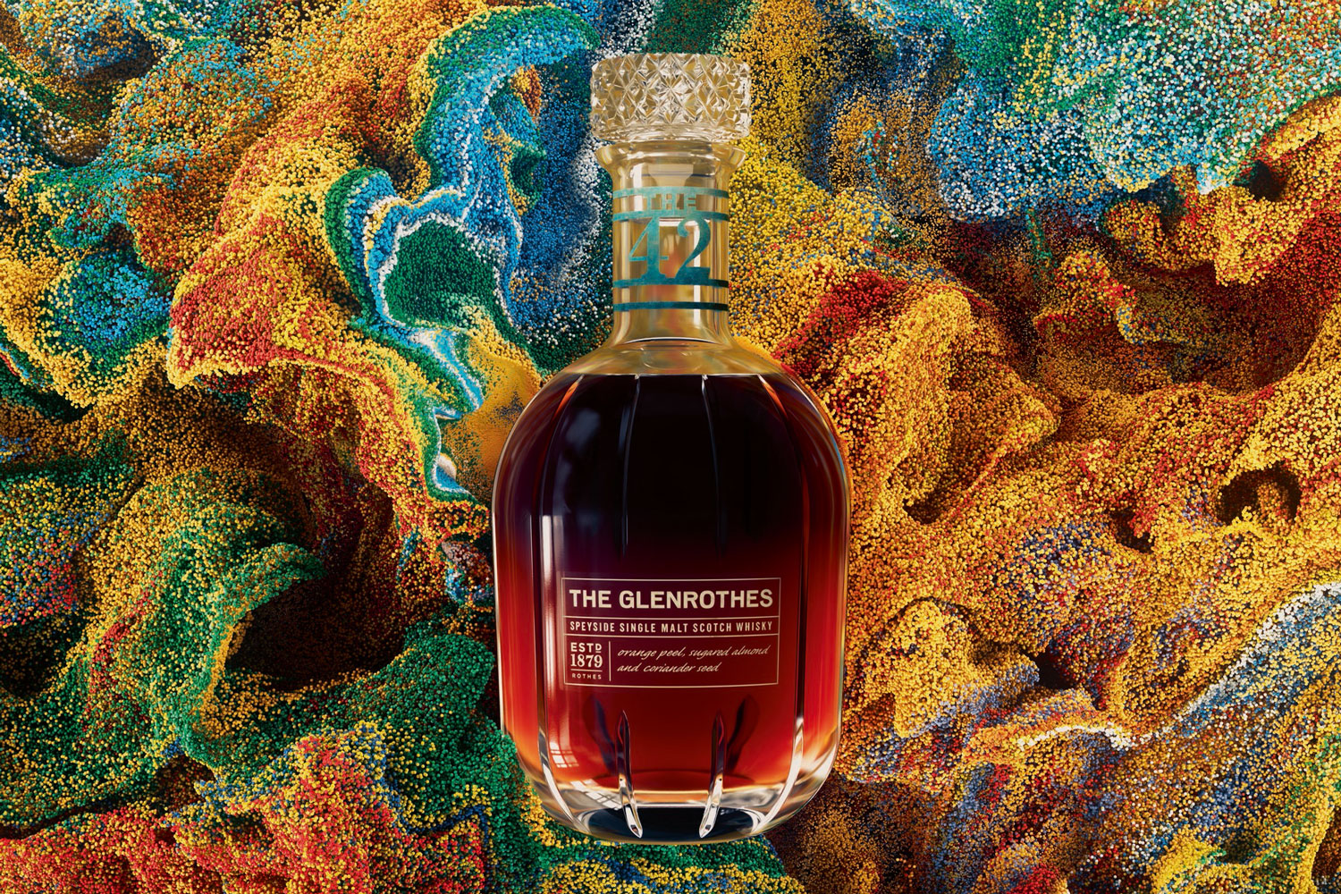 A bottle of The Glenrothes Speyside Single Malt Scotch Whiskey on a colorful background