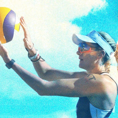 Beach volleyball player Kerri Walsh Jennings against a bright blue background.