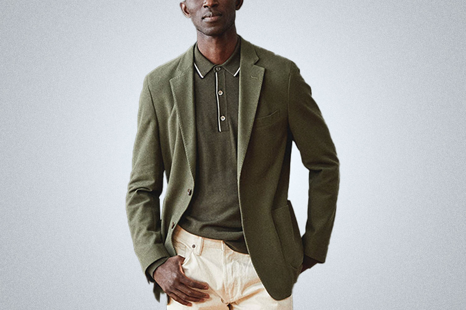 a model in a green Todd Snyder Knit Madison Sports Coat on a grey background
