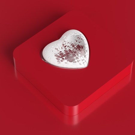 Abstract white heart shape made from torn walls inside a red box.