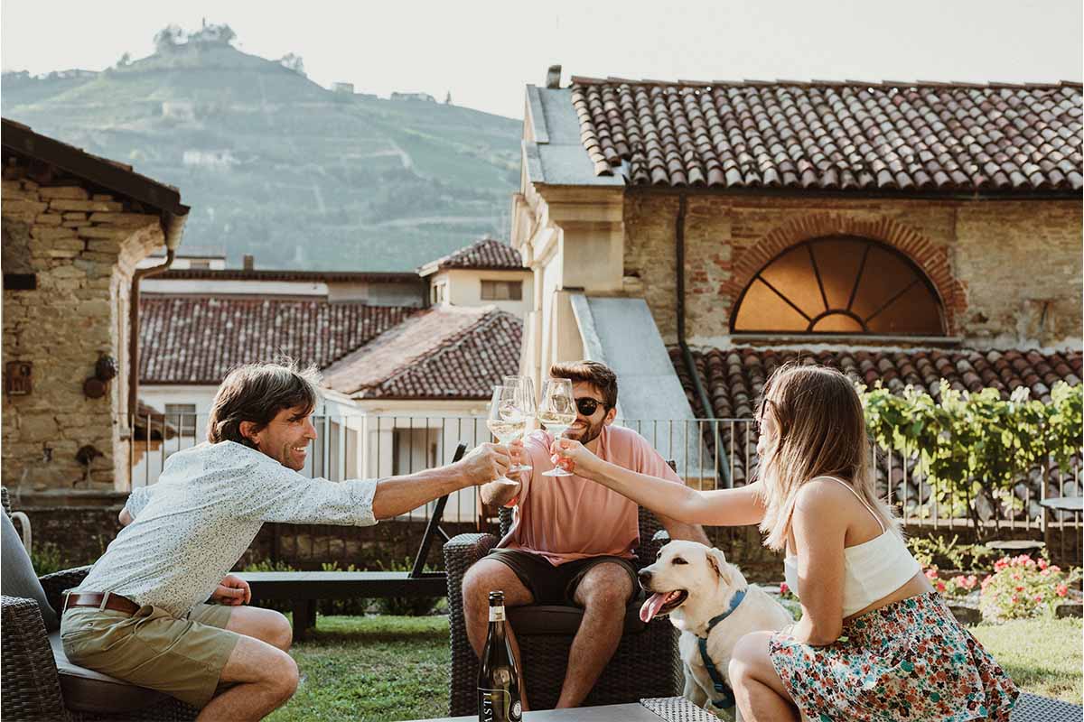 Three people drinking Spumante wine in Italy.