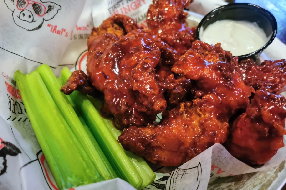 A plate of celery and boneless wings, which some people argue aren't "wings" or "boneless"
