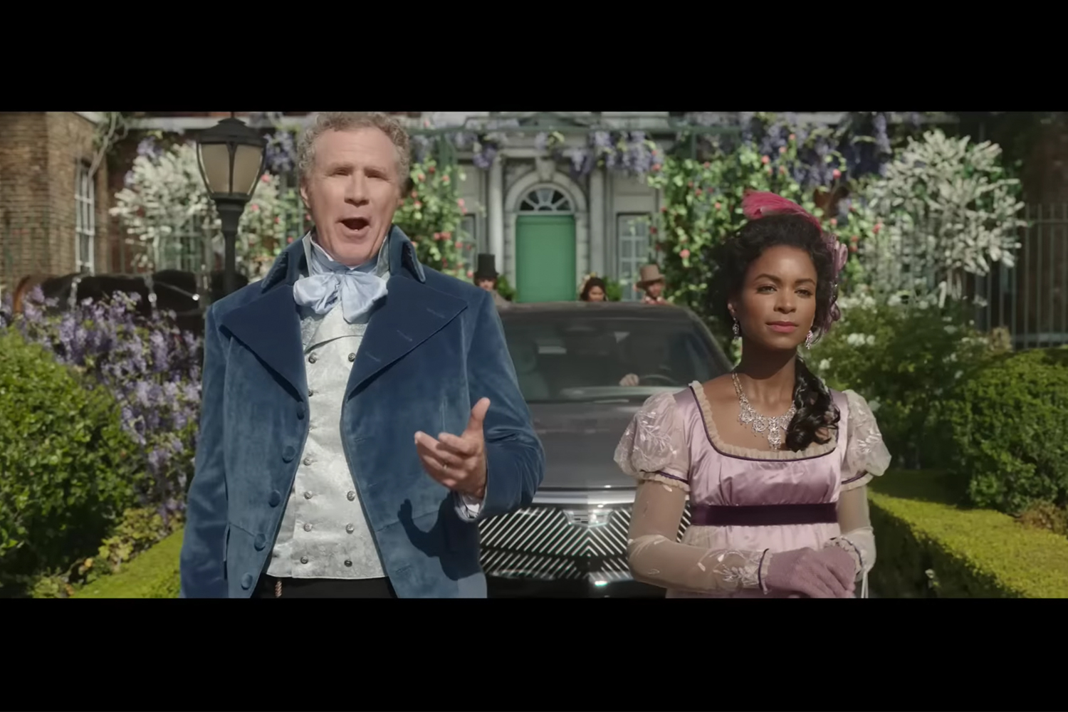 Will Ferrell walks in front of a Cadillac Lyriq in a scene inspired by "Bridgerton"
