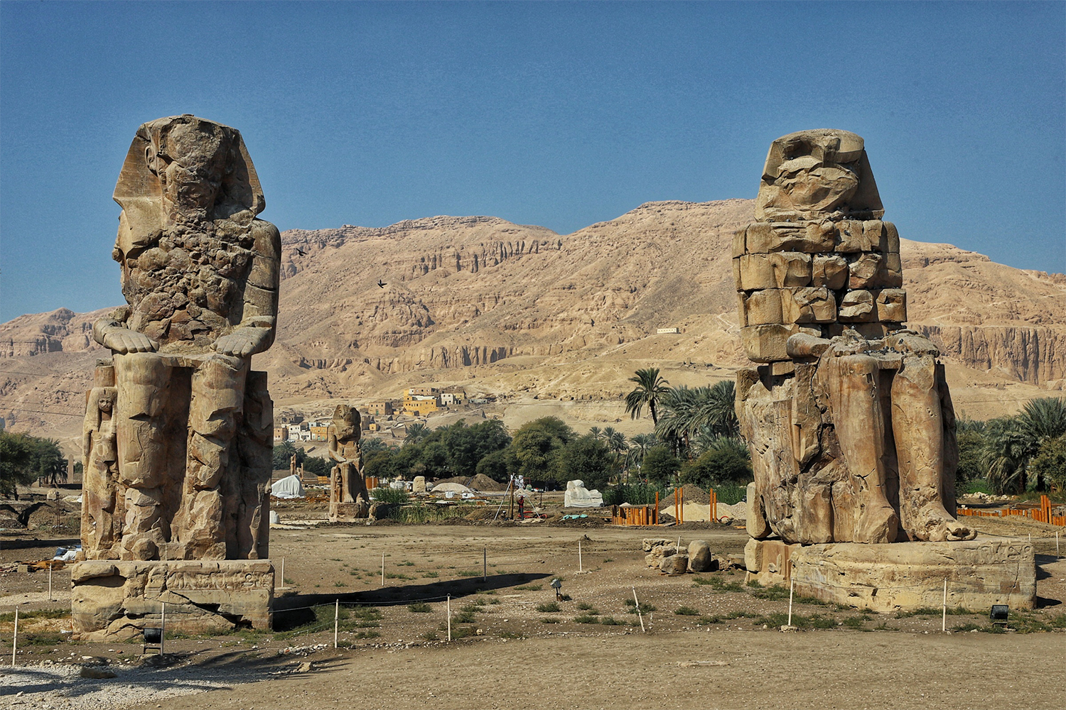 The gigantic Colossi of Memnon, two statues across the Nile River from Luxor