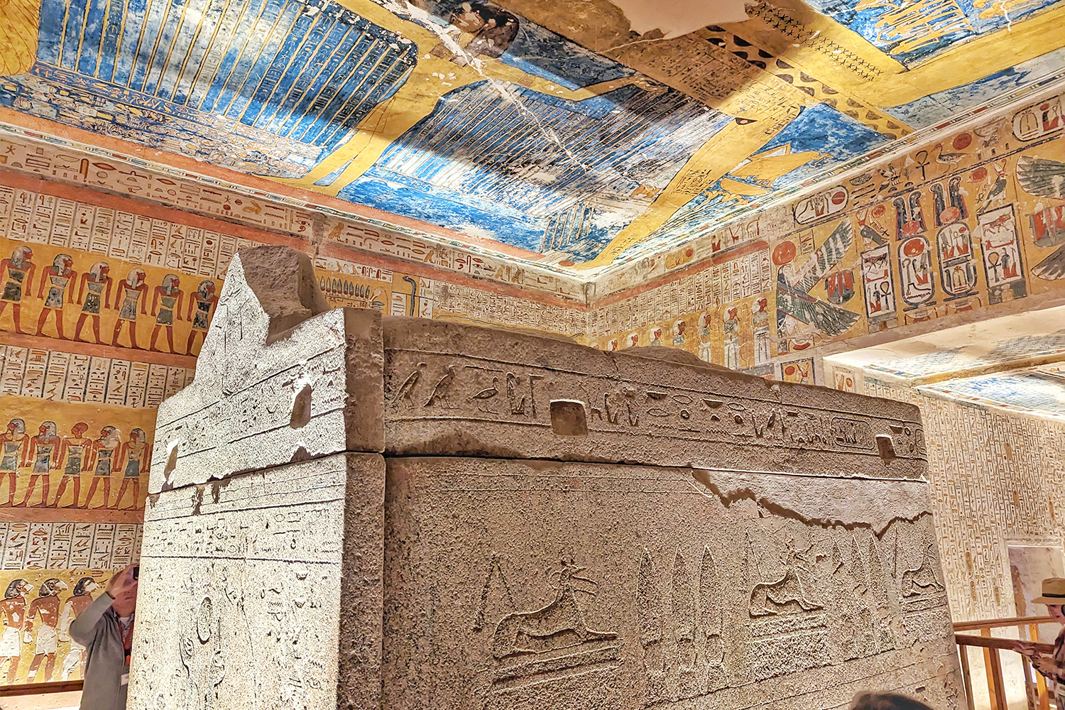 An Egyptian tomb with decorative walls and hieroglyphs