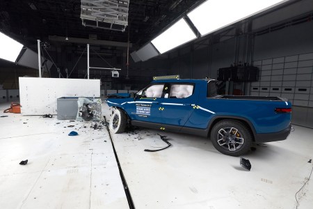 A blue Rivian R1T after a crash test at the Insurance Institute for Highway Safety