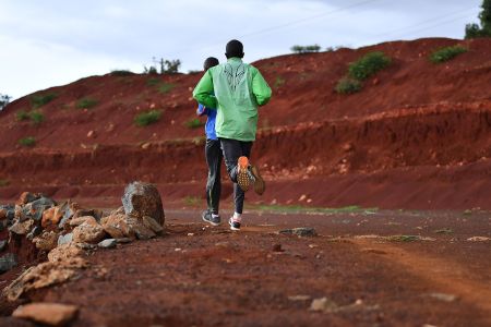Runners on red clay trails in Iten, Kenya, the "running capital of the world."