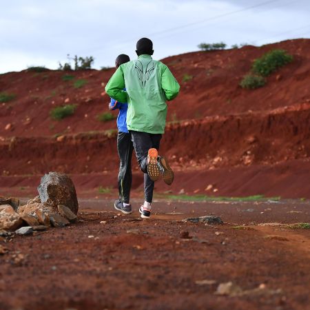 Runners on red clay trails in Iten, Kenya, the "running capital of the world."