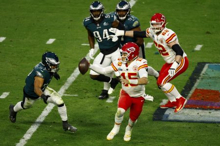 Patrick Mahomes of the Chiefs scrambles against the Eagles.