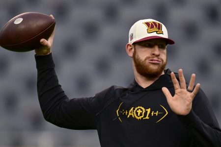Carson Wentz warms up before a game against the Bears.