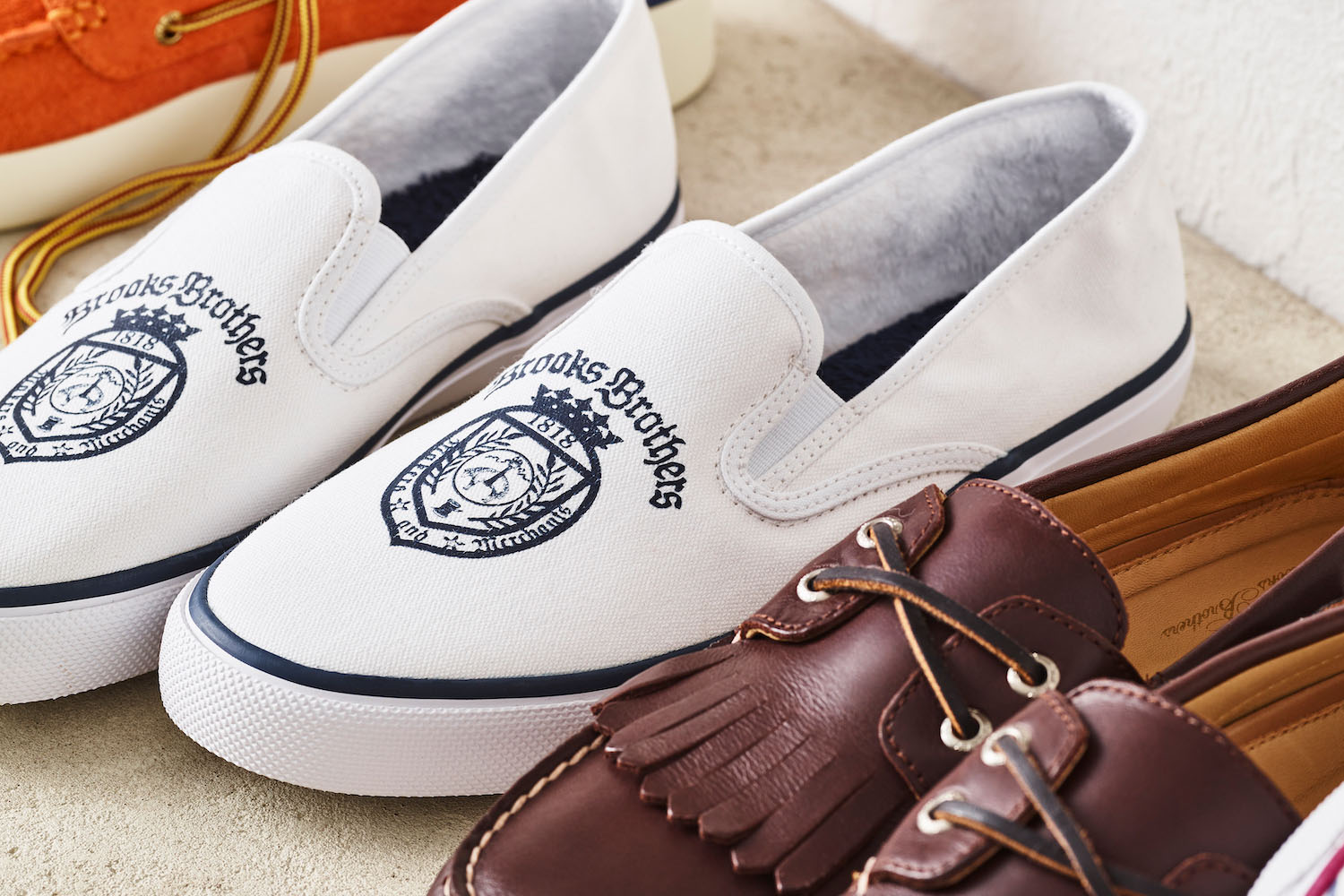 pairs of Brooks Brothers shoes on a white background