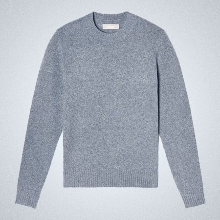 a light blue Everlane Cashmere Crewneck Sweater on a grey background