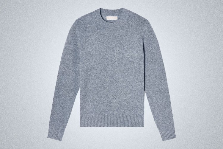 a light blue Everlane Cashmere Crewneck Sweater on a grey background