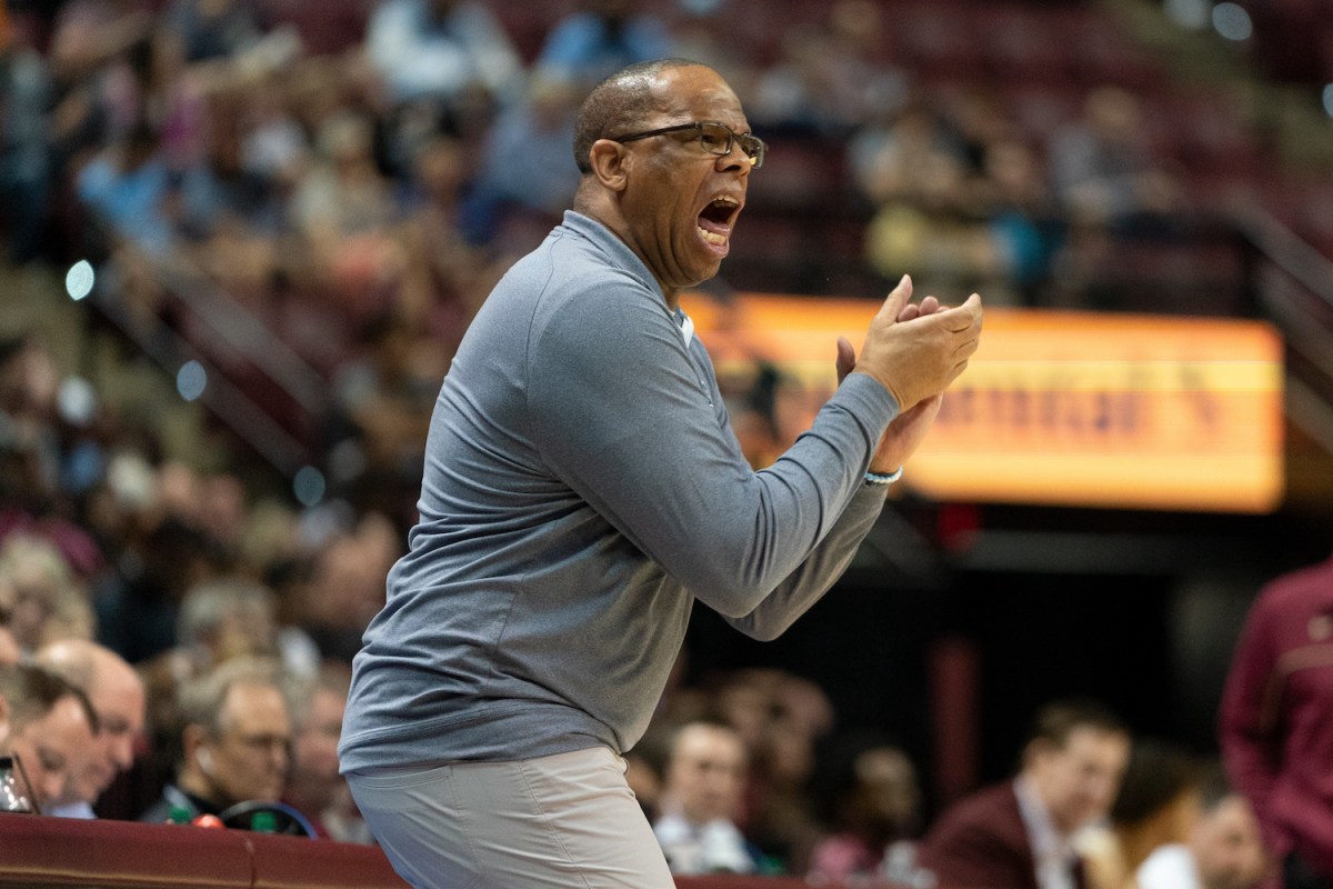 Hubert Davis, head coach of the UNC Tar Heels, yells instructions to his players from the sideline