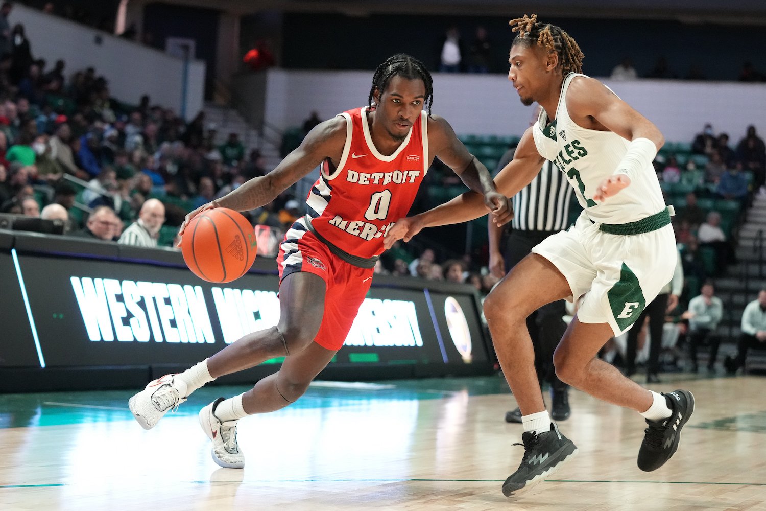 Antoine Davis of Detroit Mercy University drives against an opponent on the court