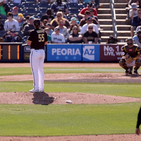 A pitch clock counts down as Jay Groome #55 of the San Diego Padres prepares to deliver a pitch to Eugenio Suarez #28 of the Seattle Mariners during the sixth inning in a spring training game at Peoria Stadium on February 24, 2023 in Peoria, Arizona.