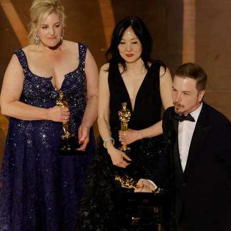 Annemarie Bradley-Sherron, Judy Chin and Adrien Morot accept the Best Makeup and Hairstyling award for "The Whale" onstage during the 95th Annual Academy Awards.