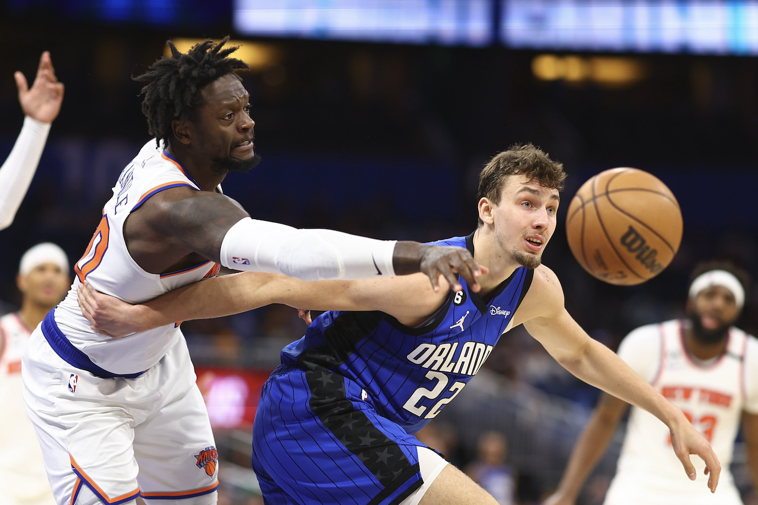 Julius Randle #30 of the New York Knicks and Franz Wagner #22 of the Orlando Magic fight for the ball during the second quarter at Amway Center on March 23, 2023 in Orlando, Florida.