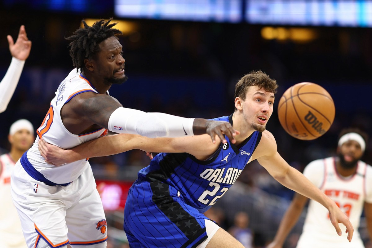Julius Randle #30 of the New York Knicks and Franz Wagner #22 of the Orlando Magic fight for the ball during the second quarter at Amway Center on March 23, 2023 in Orlando, Florida.
