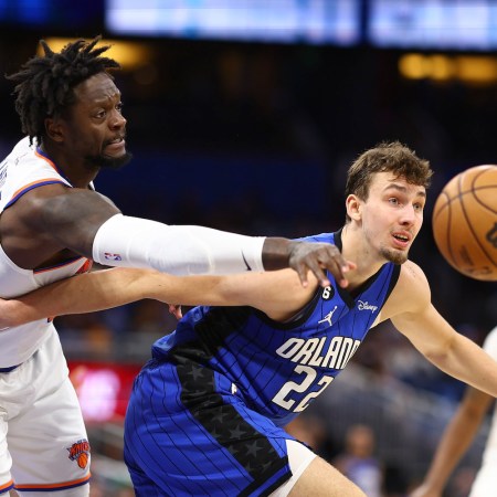 Julius Randle #30 of the New York Knicks and Franz Wagner #22 of the Orlando Magic fight for the ball during the second quarter at Amway Center on March 23, 2023 in Orlando, Florida.