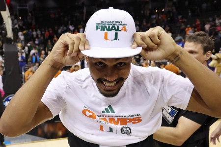 Harlond Beverly #5 of the Miami Hurricanes celebrates after defeating the Texas Longhorns 88-81 in the Elite Eight round of the NCAA Men's Basketball Tournament at T-Mobile Center on March 26, 2023 in Kansas City, Missouri.