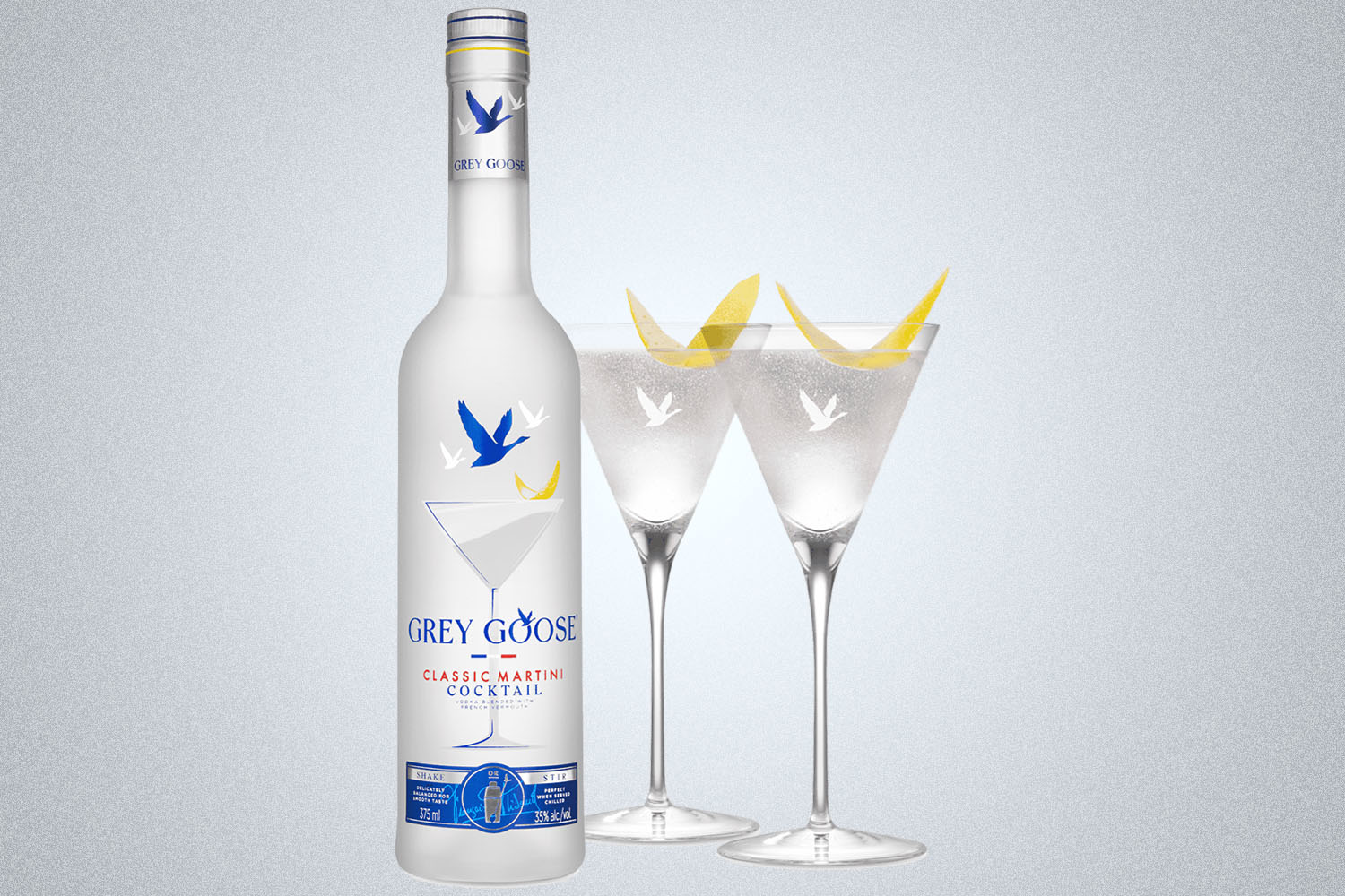 a bottle of Grey Goose Martini on a grey background