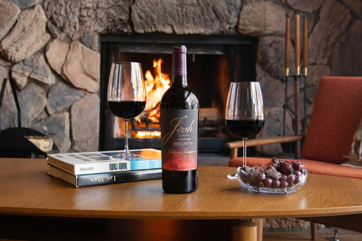 josh cellars Hearth Cabernet Sauvignon in front of a fireplaces
