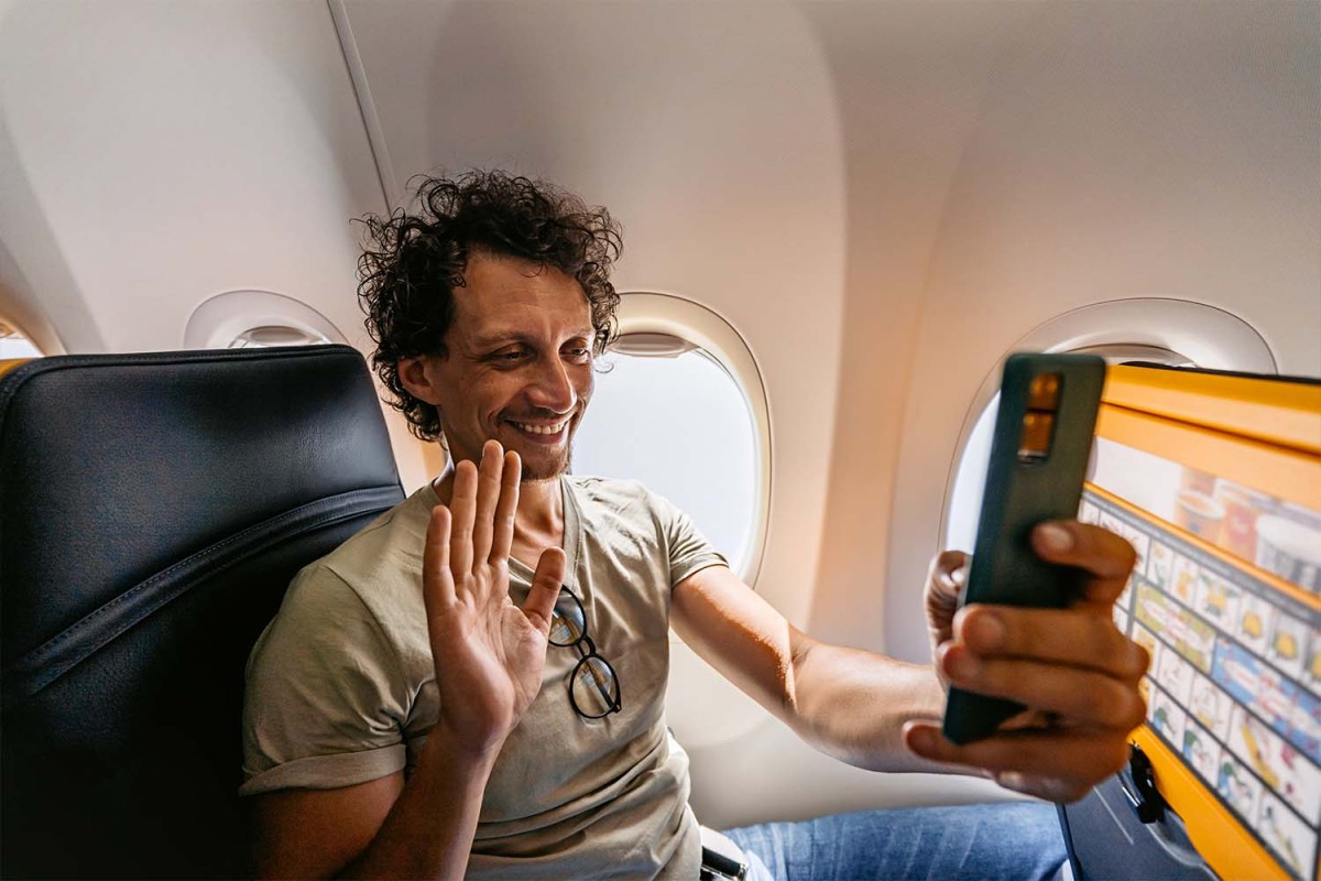 A passenger FaceTiming on an airplane inflight