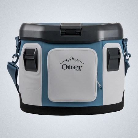a blue and grey Otterbox Trooper 20 Soft Cooler on a grey background