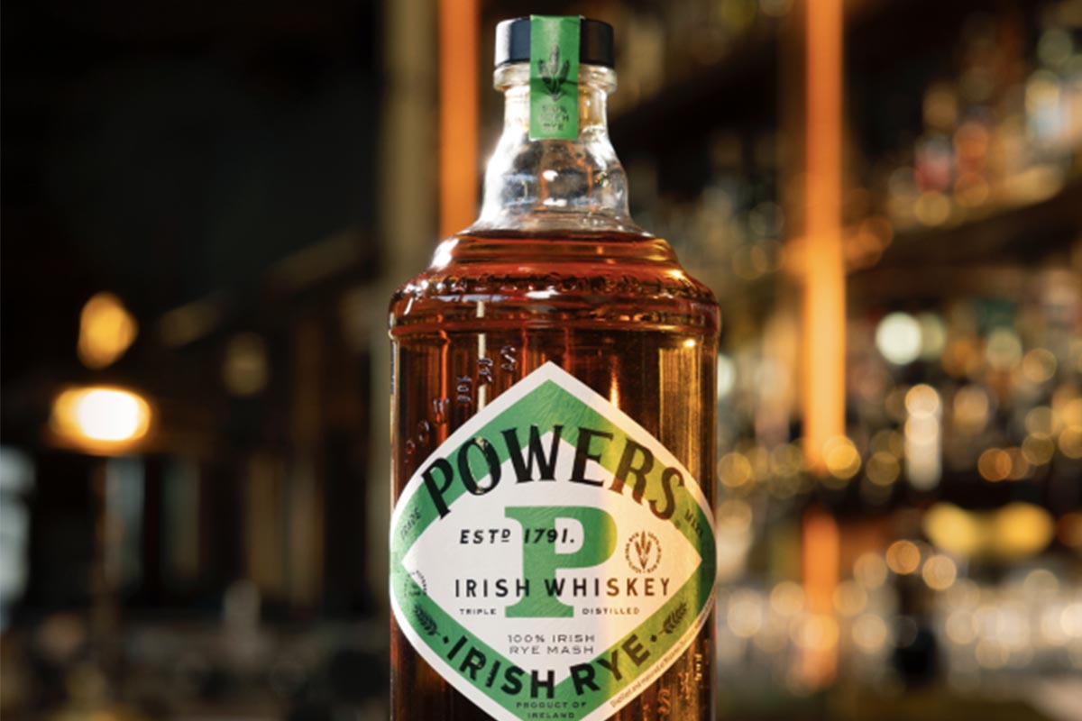 A close-up of a bottle of Powers Irish Rye, the first modern 100% Irish rye whiskey