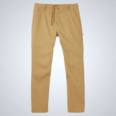 a pair of tan Proof Passport Tech Pants on a grey background