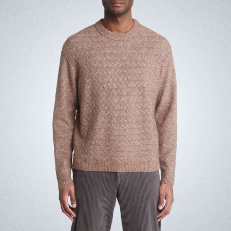 a model in a mauve wax london sweater on a grey background