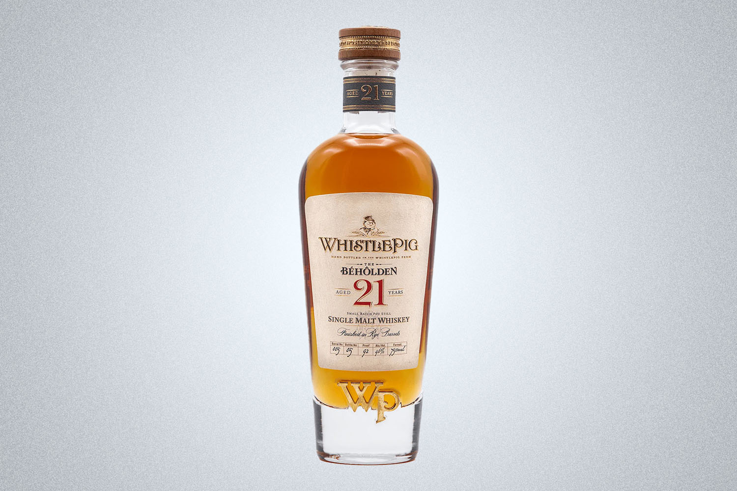 a bottle of WhistlePig Single Malt on a grey background