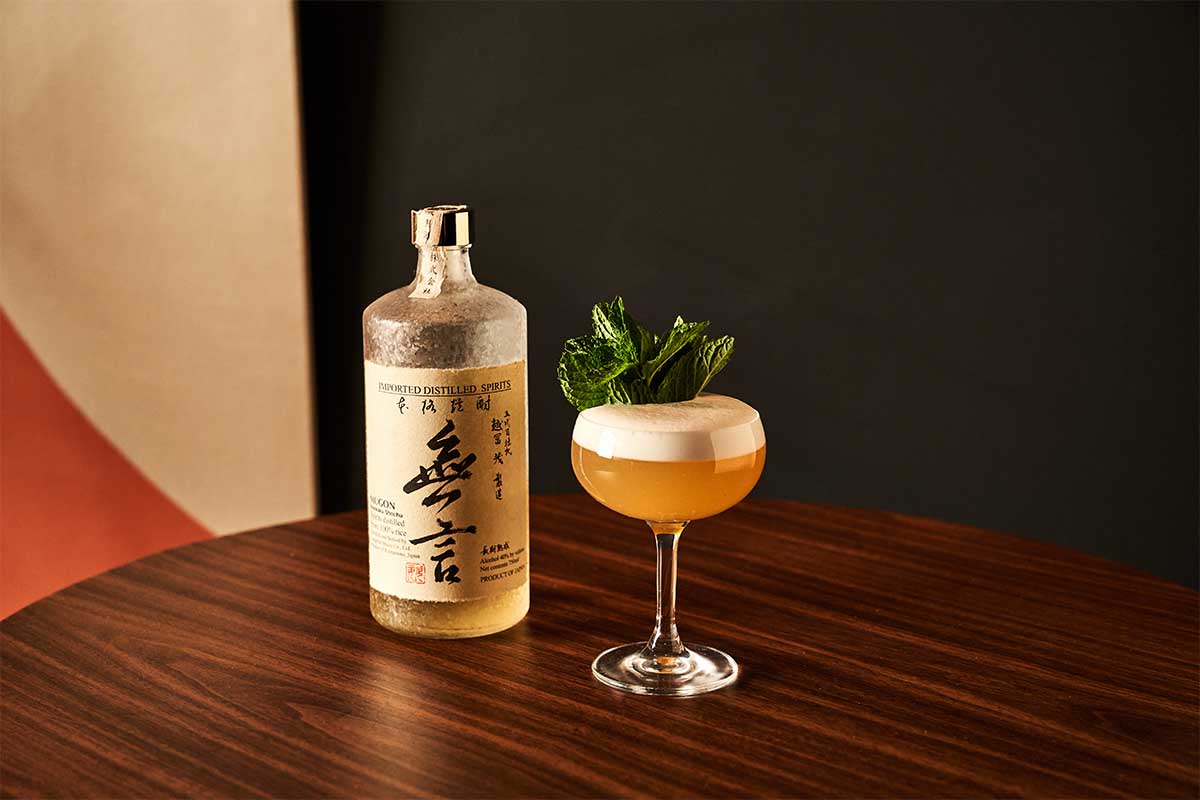 A shochu-based cocktail and bottle