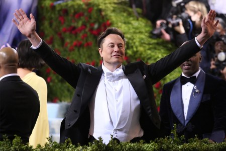 Elon Musk in white tie attire at the Met Gala in 2022. That year, his private jet had a carbon footprint 140 times the size of the average American.