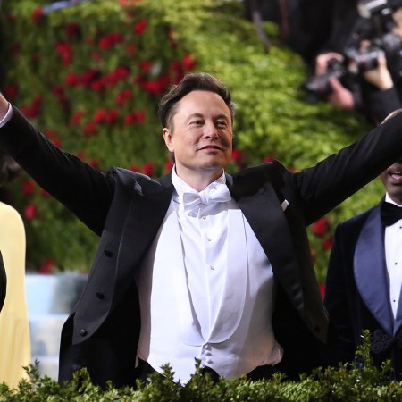 Elon Musk in white tie attire at the Met Gala in 2022. That year, his private jet had a carbon footprint 140 times the size of the average American.