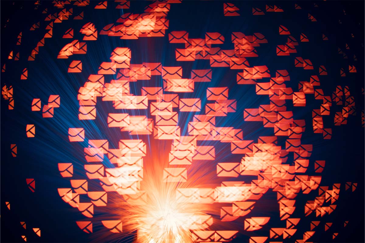 A photo illustration of email symbols floating on a blue backgroud. Companies are using AI to tame (and even write) emails.