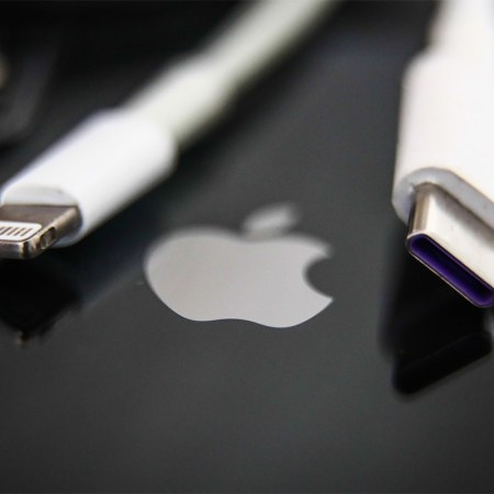 Lightning and USB-C cables are seen with Apple iPhone in this illustration photo taken in Krakow, Poland on September 25, 2021.