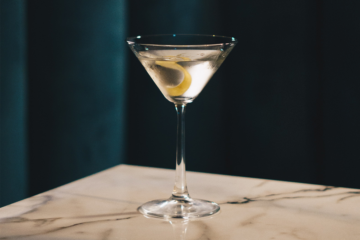 A martini with a lemon twist