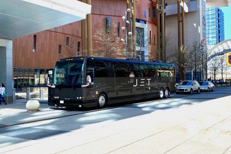 The Jet, a luxury bus that travels from NYC to D.C., shown parked at the curb