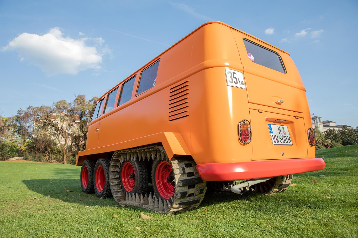 The orange Volkswagen Half-Track Fox, an orange Type 2 Transporter van with tank-like tracks