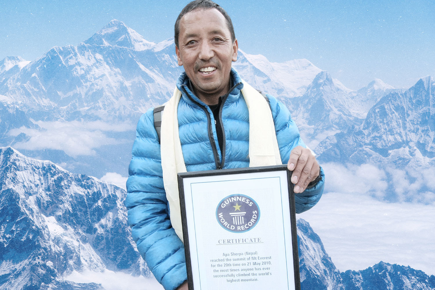 Apa Sherpa, a Nepalese climbing legend, holding his Guinness World Record plaque after achieving the record for the most summits of Mount Everest