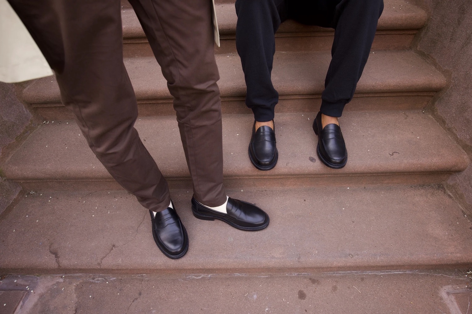 two models in the Blackstock & Weber The Ellis Penny Loafer, Exclusively for JJJJound on a staircase outside