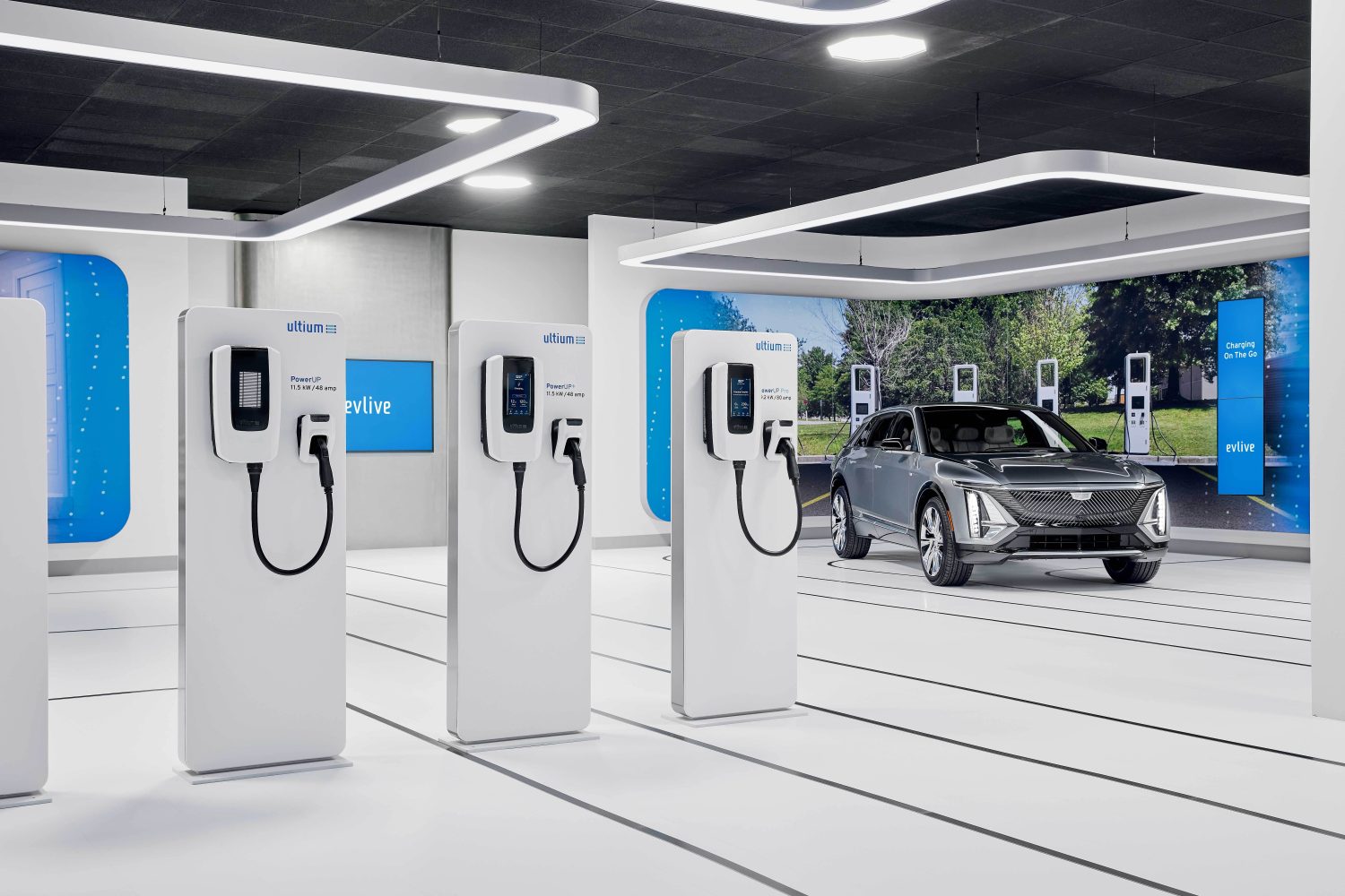 Car chargers lined up with an electric car driving next to it.