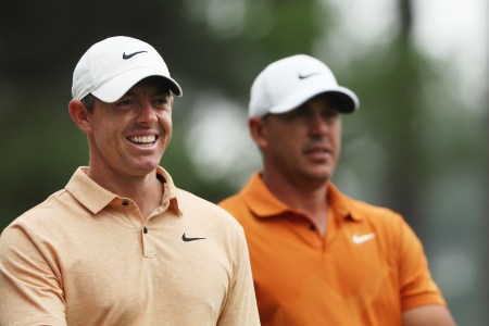 Rory McIlroy of Northern Ireland and Brooks Koepka of the United States look on during a practice round prior to the 2023 Masters Tournament at Augusta National Golf Club on April 04, 2023 in Augusta, Georgia.