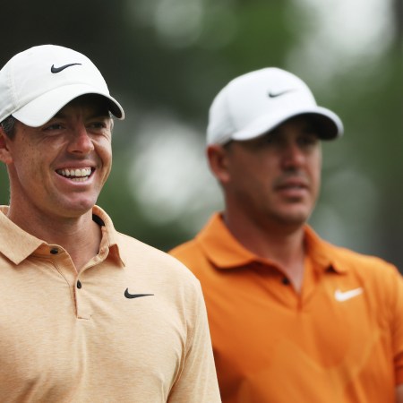 Rory McIlroy of Northern Ireland and Brooks Koepka of the United States look on during a practice round prior to the 2023 Masters Tournament at Augusta National Golf Club on April 04, 2023 in Augusta, Georgia.